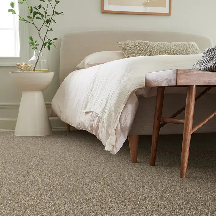 A well-furnished bedroom with soft carpeting and a comfortable bed, highlighting a serene space in Milwaukee, WI.