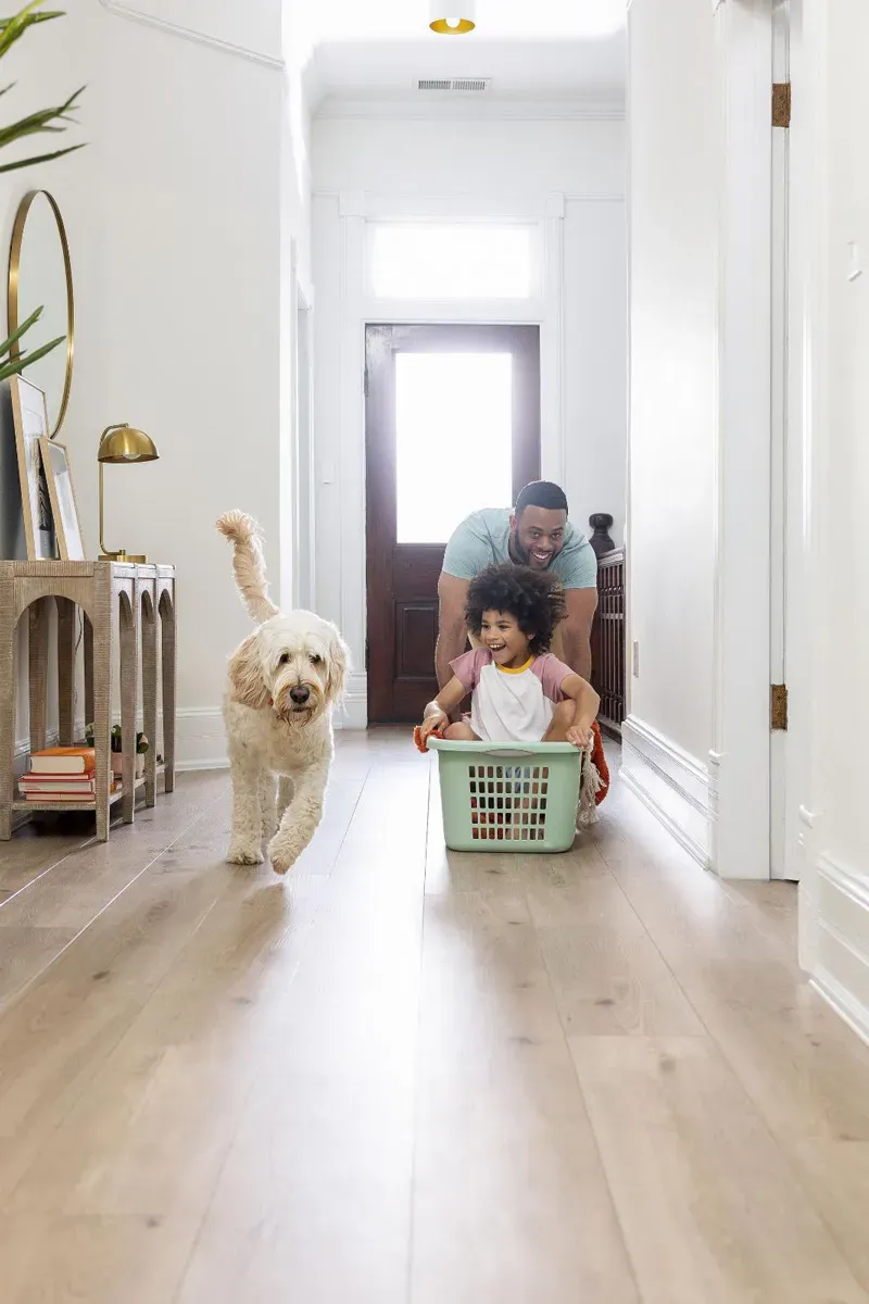 Family playing on hardwood floors