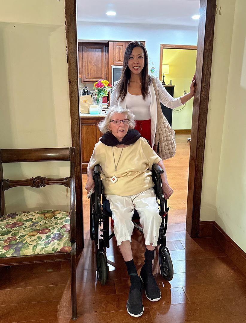 Mrs. Taylor in wheelchair with Jennie Hong