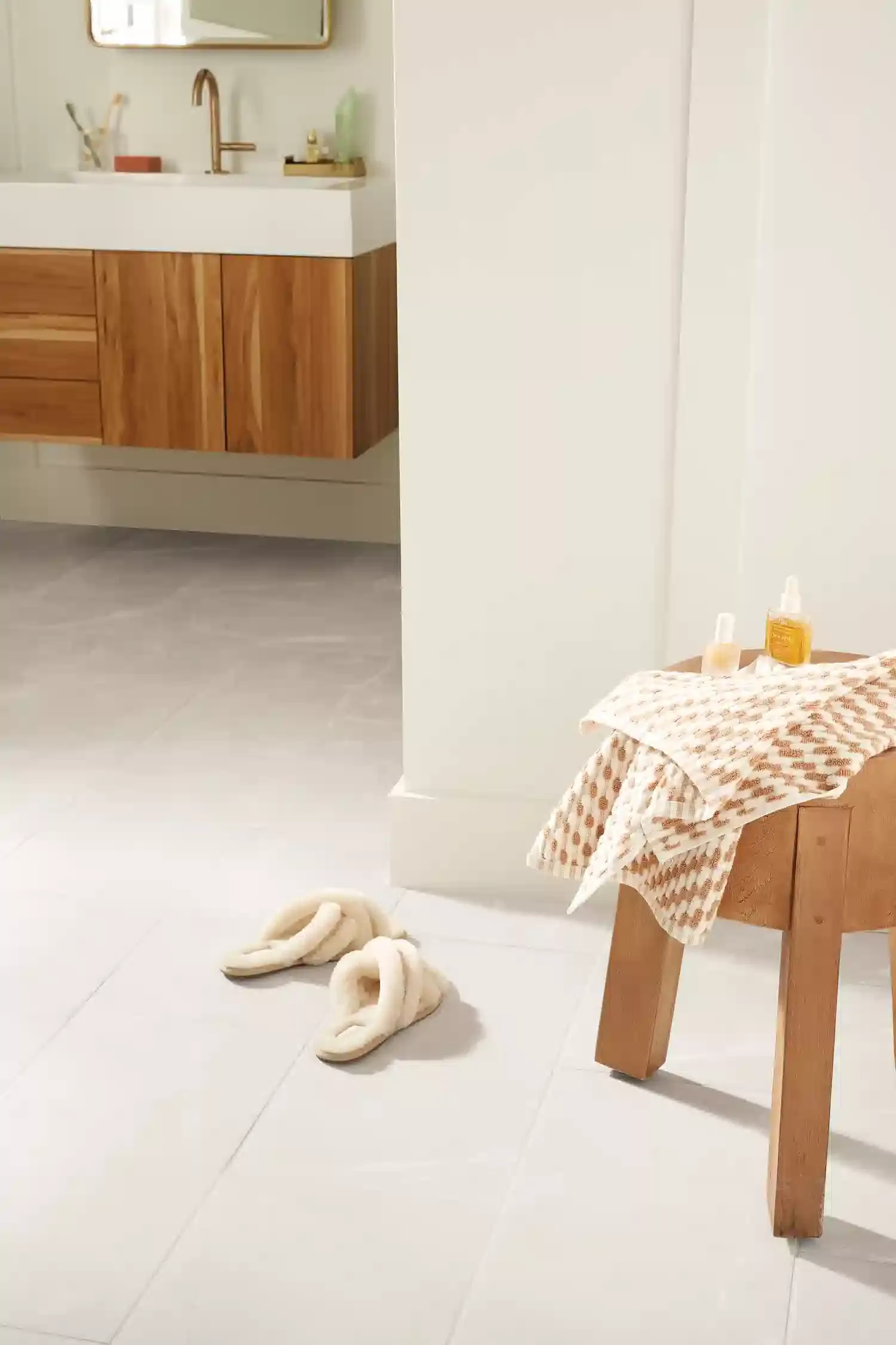 Tile flooring in bathroom with cozy slippers