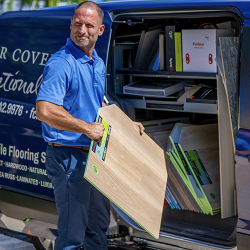 man holding flooring sample board