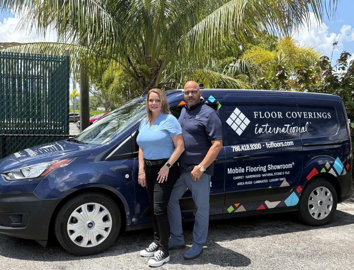 Maribel & William in front of van