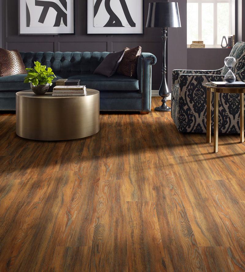 Luxury vinyl tile with a warm wood grain in a stylish living room